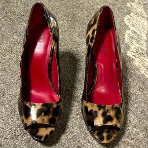 Worn once, in great condition just too high for me. 4” heel. Animal print